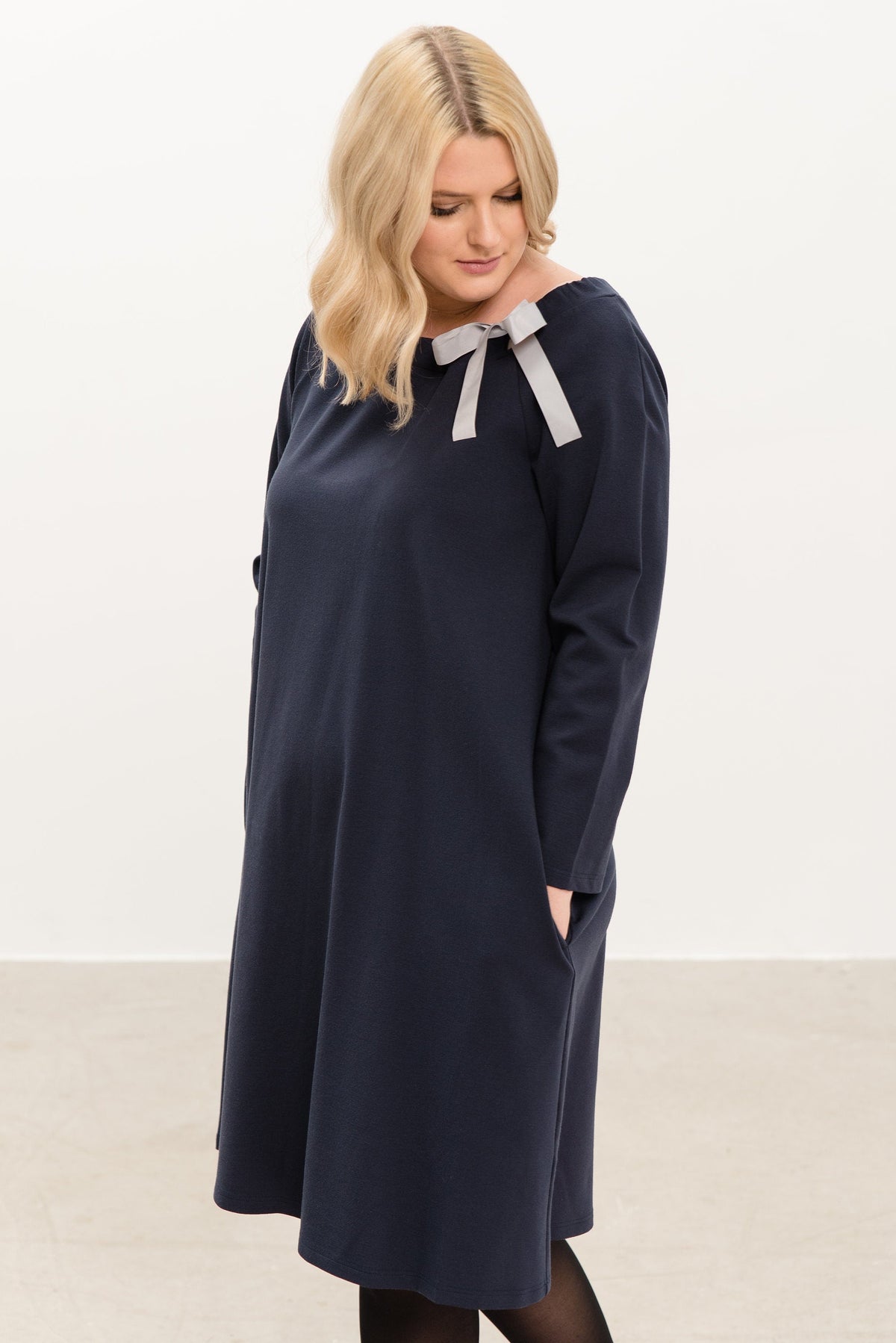 FRENCH – Italian Punto Milano Ribbon Neck A-Line Dress – deep blue dress, three-quarter side view with the grey ribbon bow #Color_Deep blue