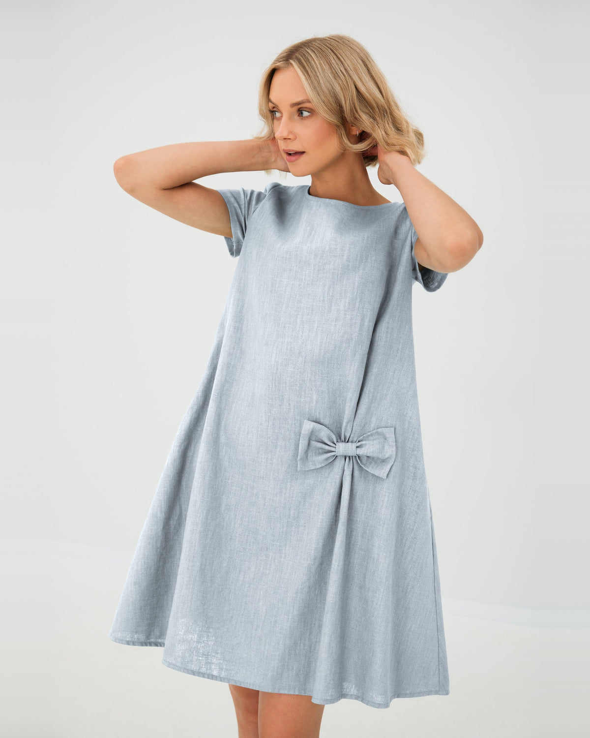LeMuse SUMMER KISS linen dress in light blue – studio front view, hands in hair #Color_Light blue