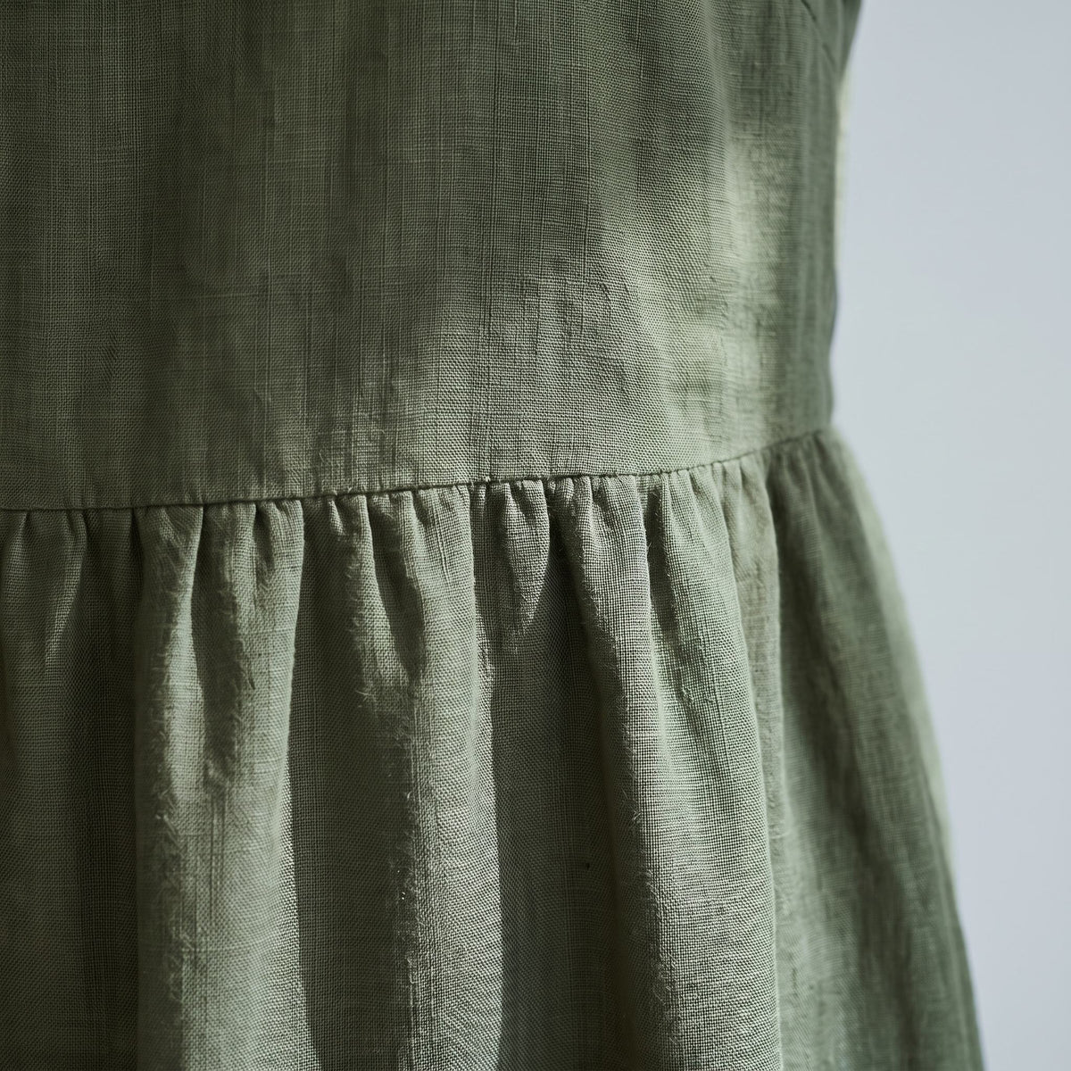 An olive green linen dress.