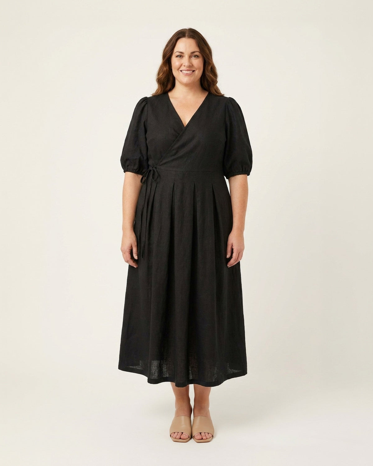 BONNIE SUPERSTAR – Linen Blend Puff Sleeve Tie-Waist Dress — Plus Size – black linen dress, full-length front view in the studio #Color_Black