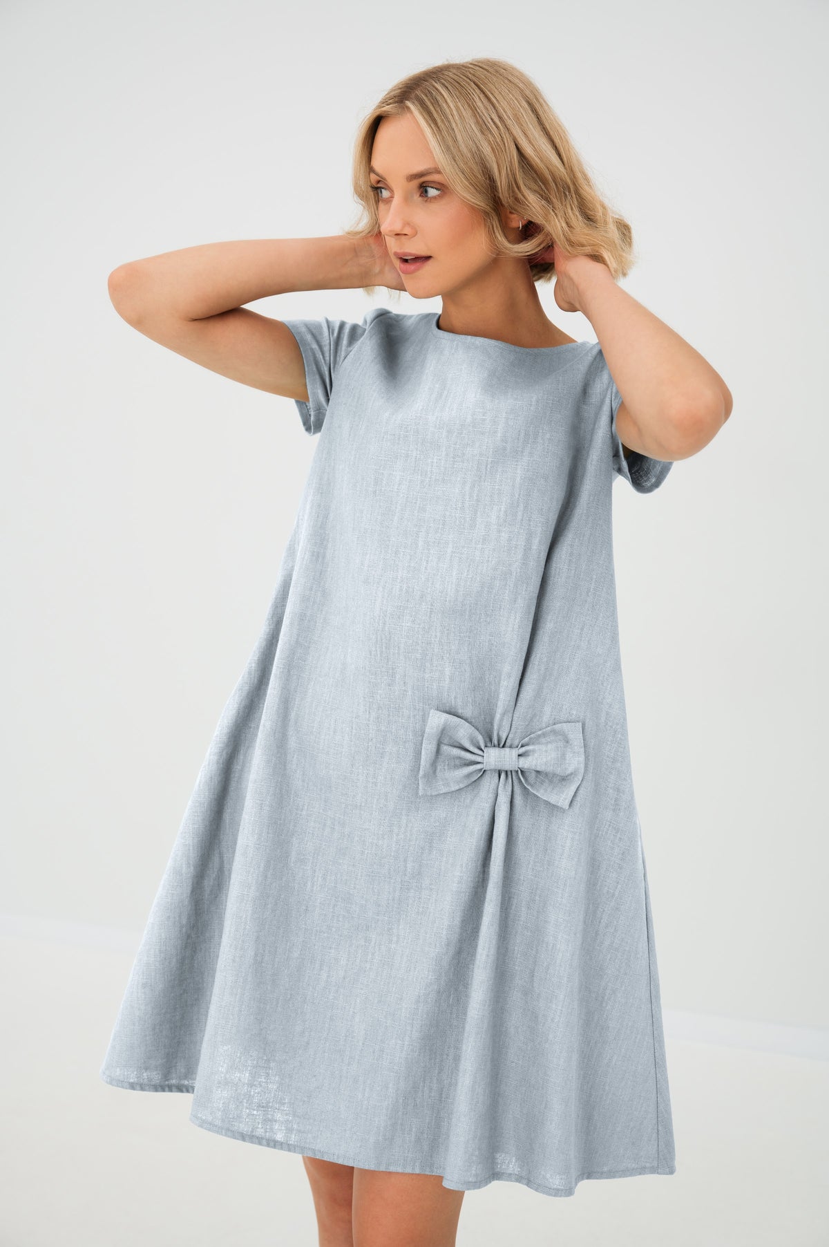LeMuse SUMMER KISS linen dress in light blue – studio front view, hands in hair #Color_Light blue