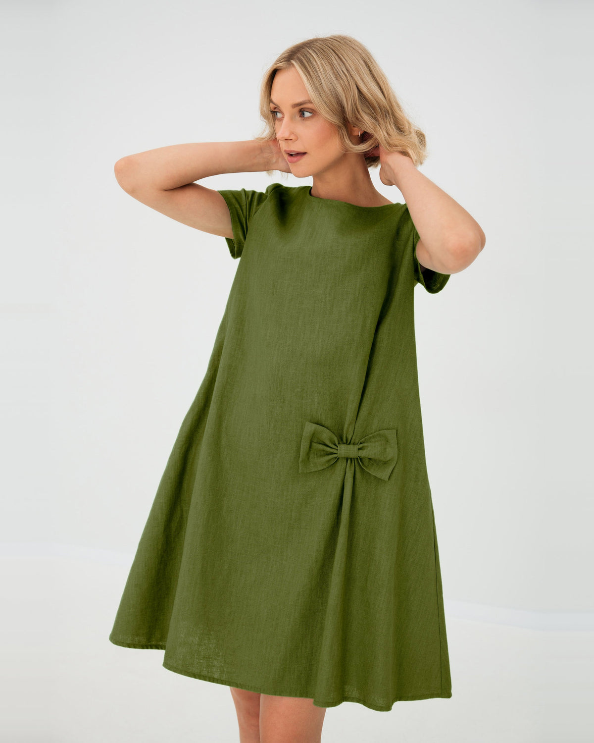LeMuse SUMMER KISS linen dress in olive green – studio front view, hands in hair #Color_Olive green