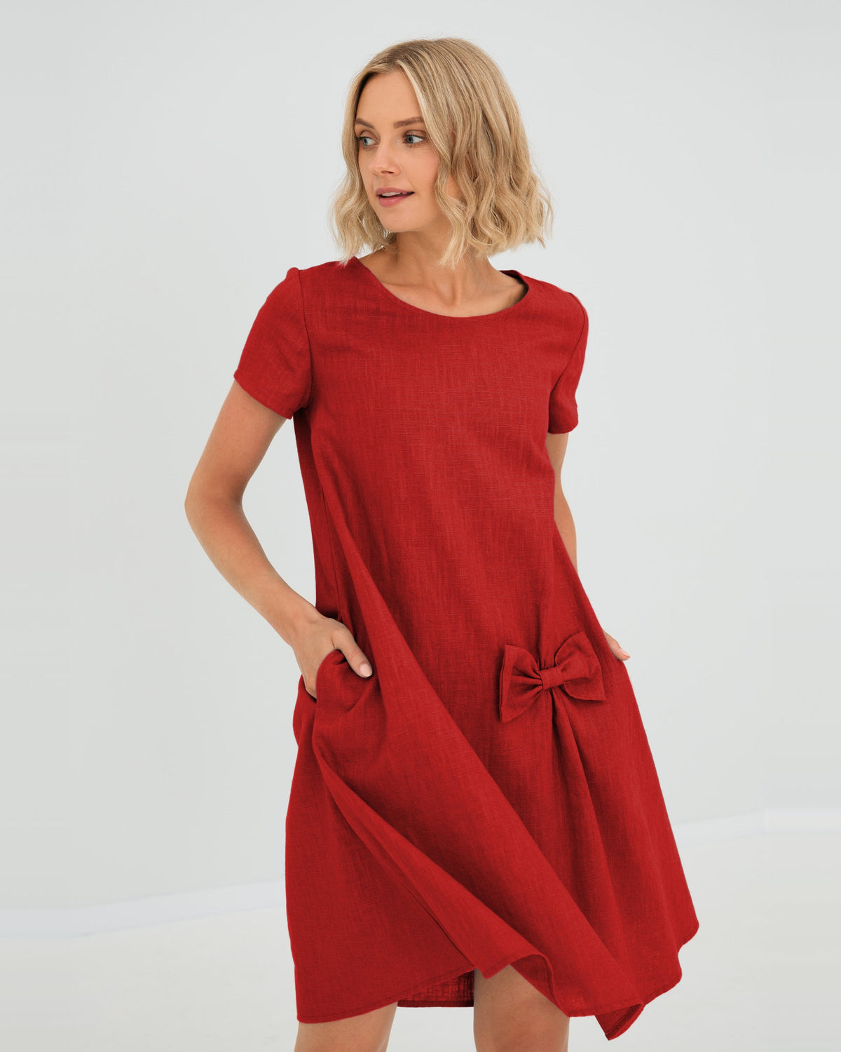 LeMuse SUMMER KISS linen dress in red – studio front view, hand in pocket #Color_Red
