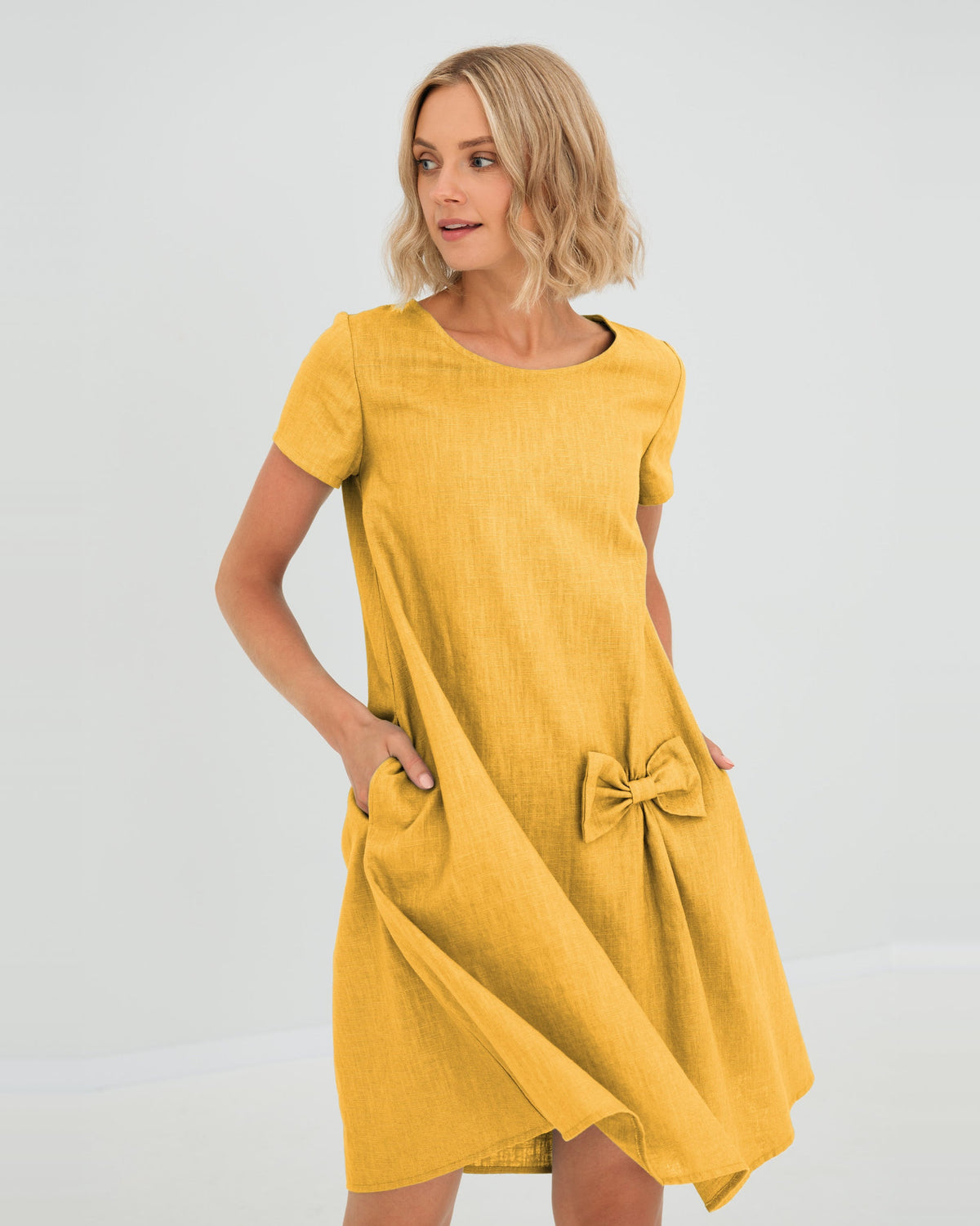 LeMuse SUMMER KISS linen dress in yellow – studio front view, hand in pocket #Color_Yellow