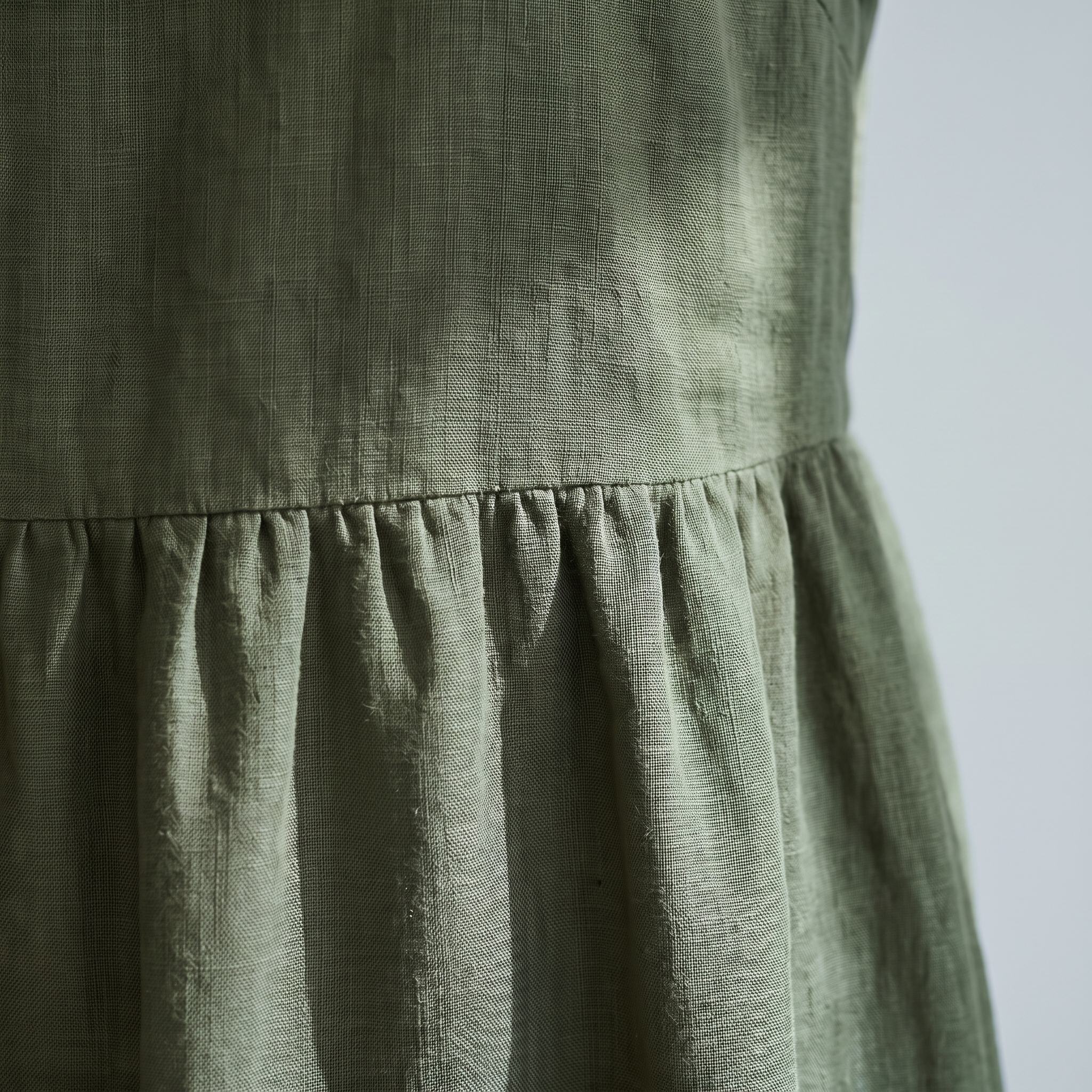 An olive green linen dress.